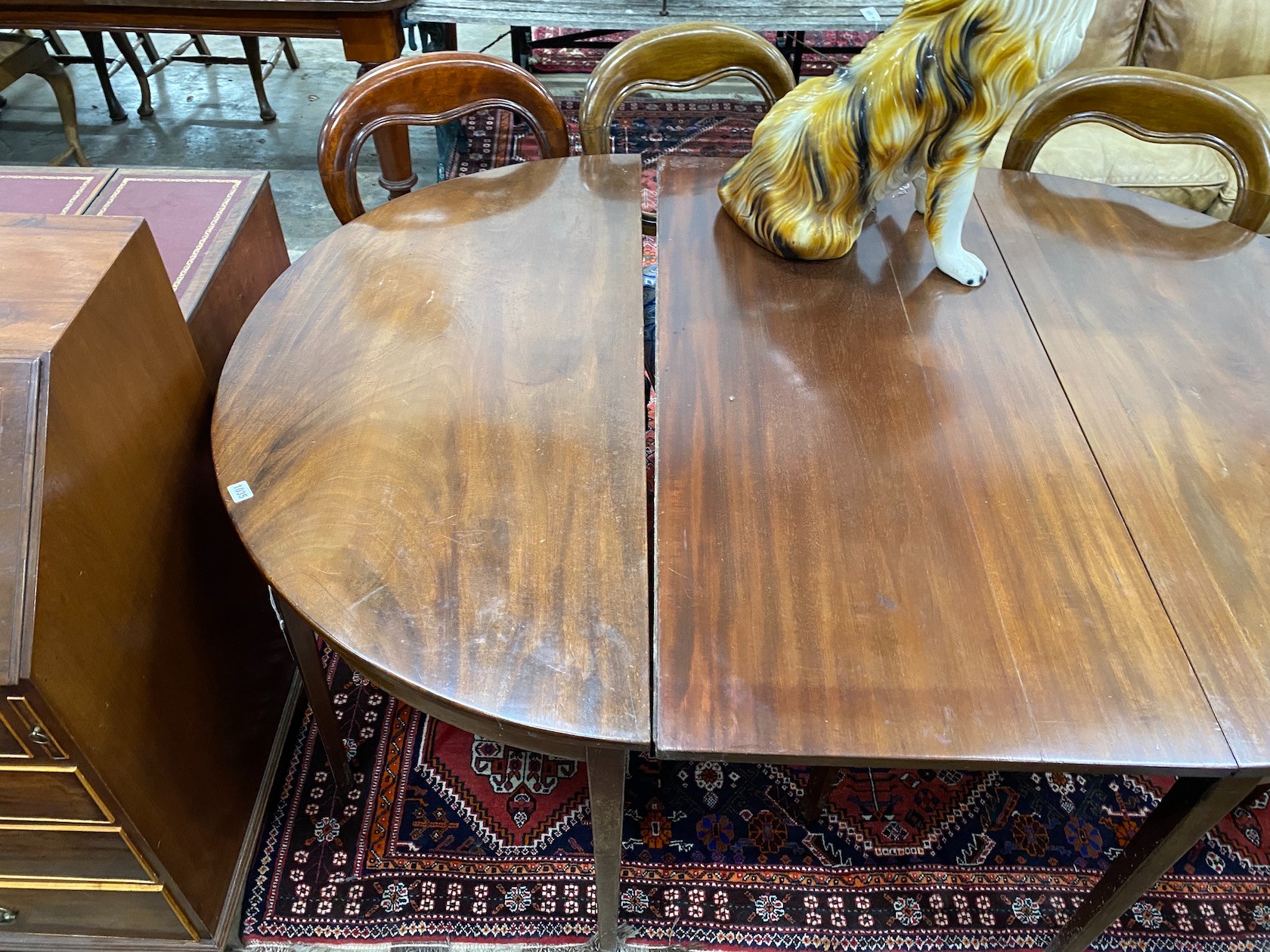 A George III mahogany D end extending dining table with later drop leaf, 180cm extended, depth 127cm, height 74cm